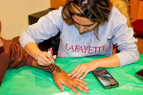 Students sat for henna drawings at ISAs Wednesday event Decolonizing Beauty in South Asia.