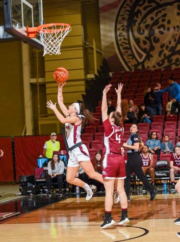 Sophomore Abby Antognoli goes for a lay up in the waining seconds of the Leopards victory. (Photo by Hannah Ally for GoLeopards)  