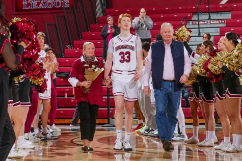Captain Leo O’Boyle was joined by his parents in a Senior Day celebration before scoring 17 points. (Photo by Rick Smith for GoLeopards)