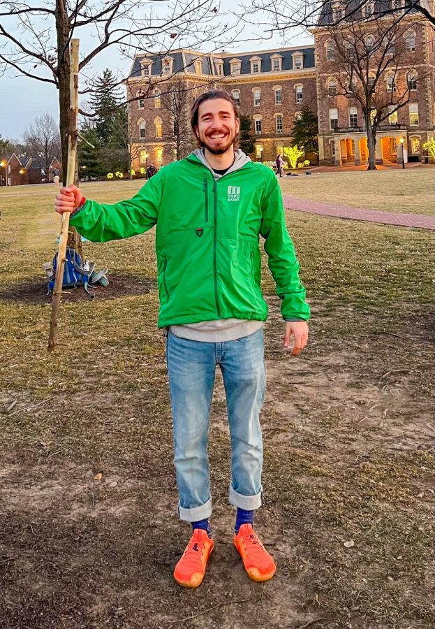Remy Oktay 24 uses the stick from his Art and the Environment class as a form of community-based art. (Photo courtesy of Remy Otkay 24)