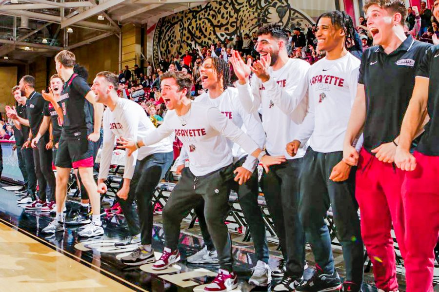 The mens basketball team celebrates its Sunday night win against American, which sent it to the Patriot League finals. (Photo by Rick Smith for GoLeopards)