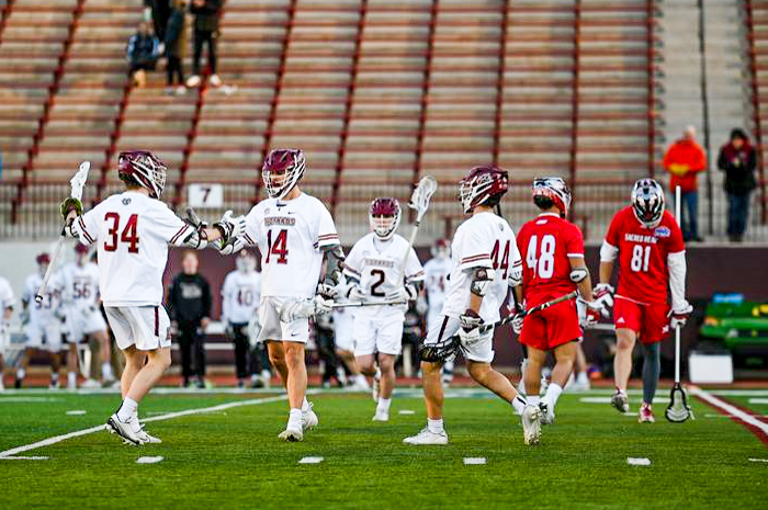The+members+of+the+mens+lacrosse+team+congratulate+each+other+after+their+10-4+victory.+%28Photo+courtesy+of+GoLeopards%29