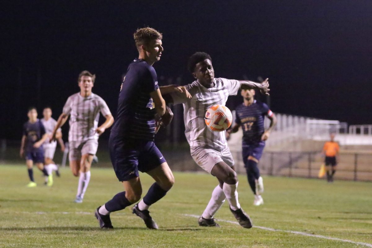 Junior Lawrence Aydlett works around a Drexel defender in their 1-1 draw on Aug. 28. (Photo by Rick Smith for GoLeopards)