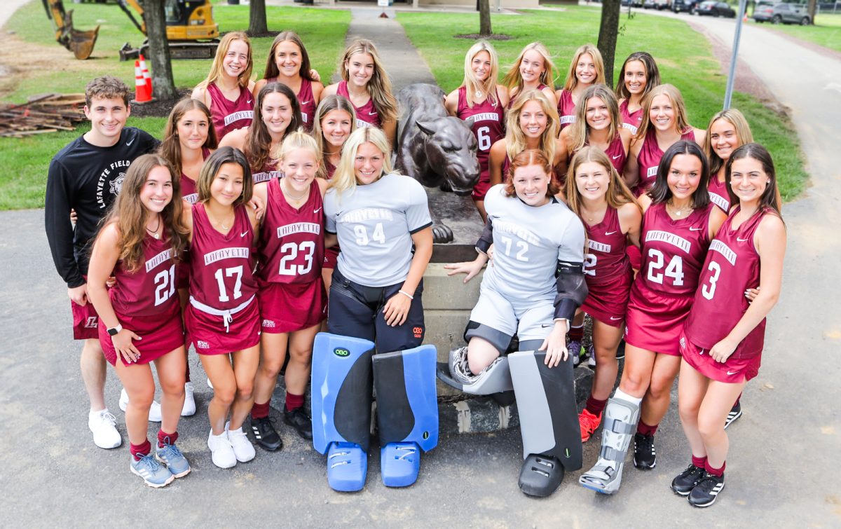 The+field+hockey+team+poses+with+sophomore+Leo+Baumgardner+at+Metzgar+Fields.+%28Photo+by+Rick+Smith+for+GoLeopards%29