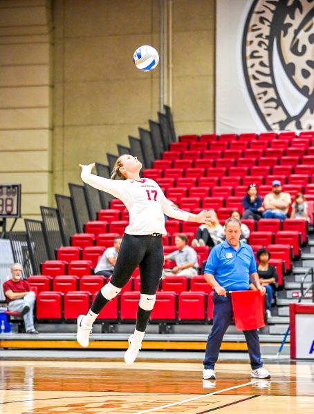 Junior libero Elizabeth Flynn serves during the Leopards victory over Holy Cross. (Photo by George Varkanis for GoLeopards)