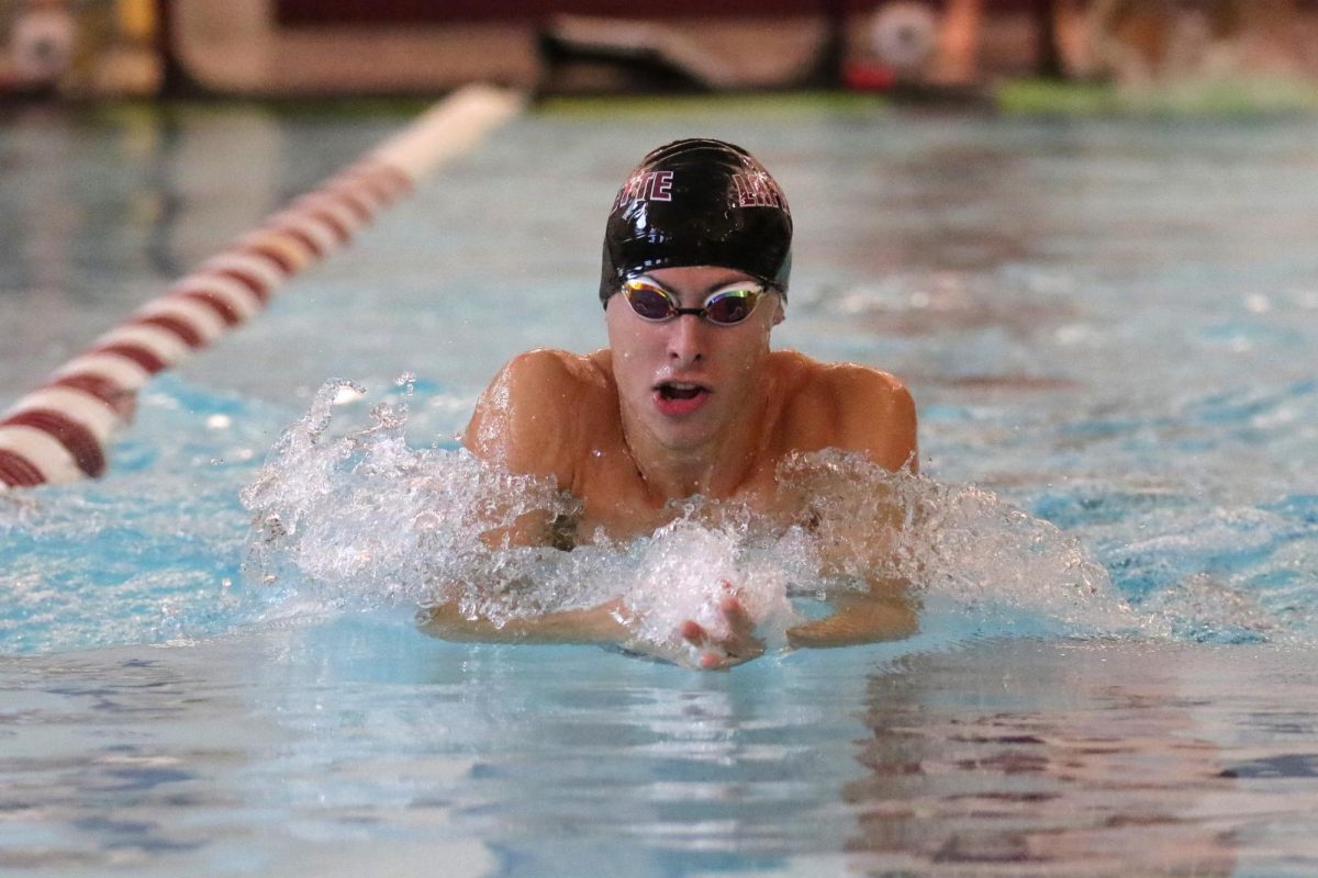 Junior Sean Robinson swims down the lane during the Leopards dual meet against Loyola Maryland. (Photo by Rick Smith for GoLeopards)