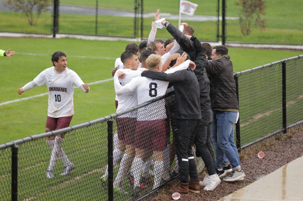 The mens soccer team celebrates with fans on Saturday during its 2-0 win. (Photo by Rick Smith for GoLeopards)
