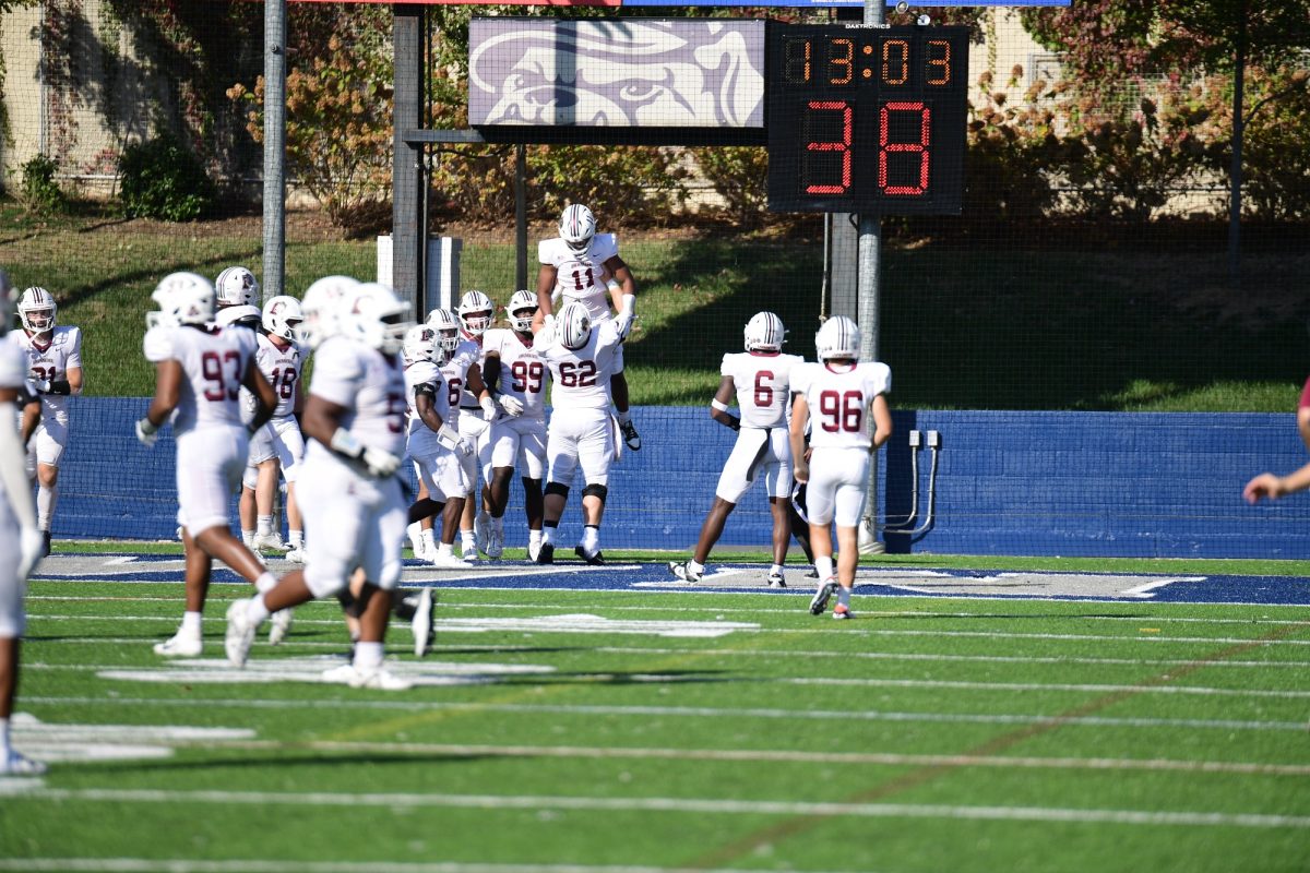 The Leopards celebrate junior defensive back Saiku Whites pick six against Georgetown. (Photo by Hannah Ally for GoLeopards)