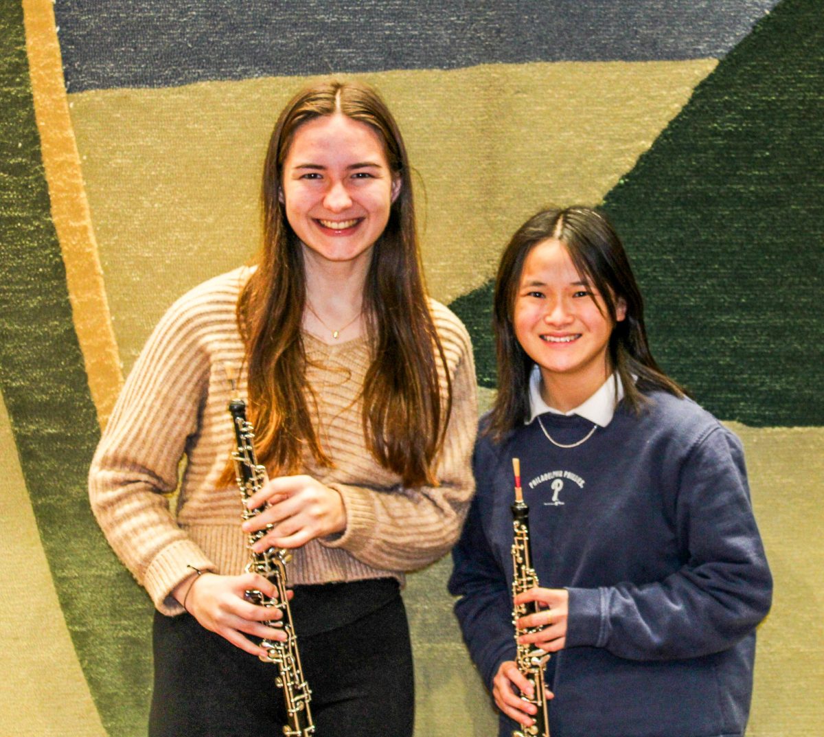 Olivia Hofmann 24 and Olivia Bamford 24 both transitioned from violin to oboe before high school.