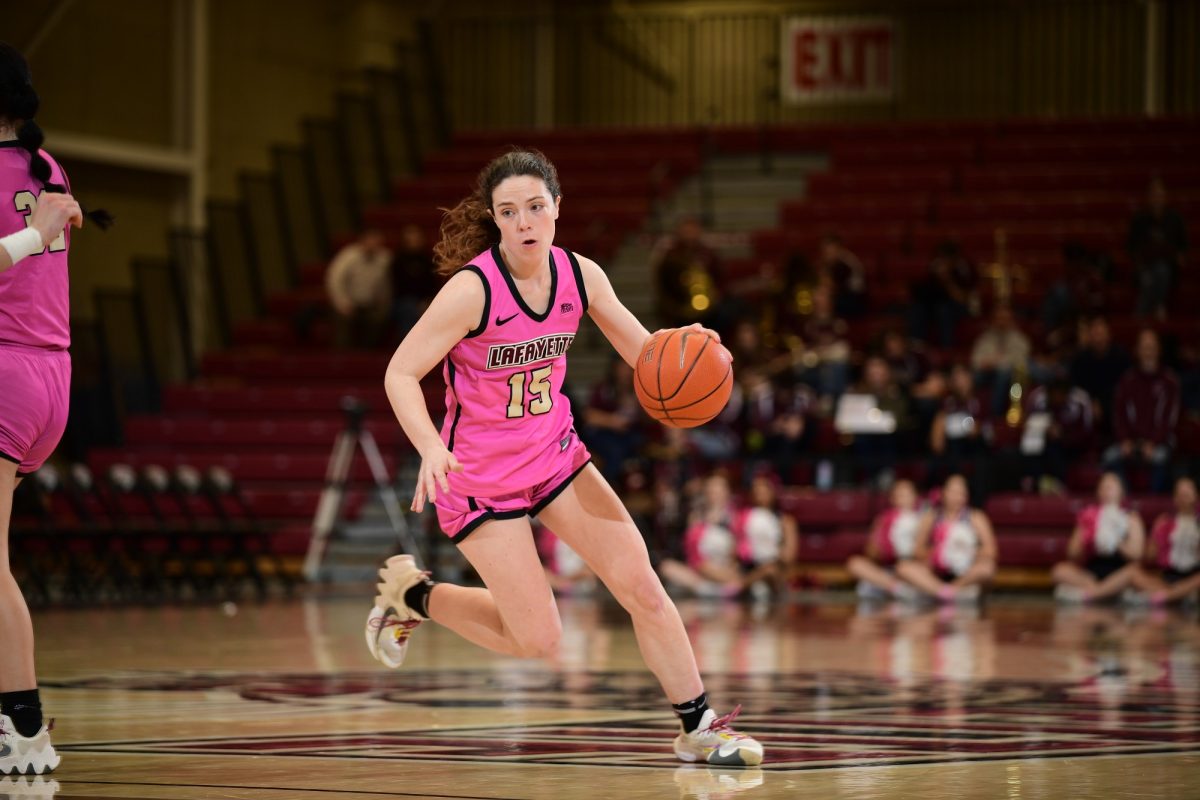 Sophomore guard Kay Donahue dribbles through the lane during the Leopards win over American. (Photo by Hannah Ally for GoLeopards)