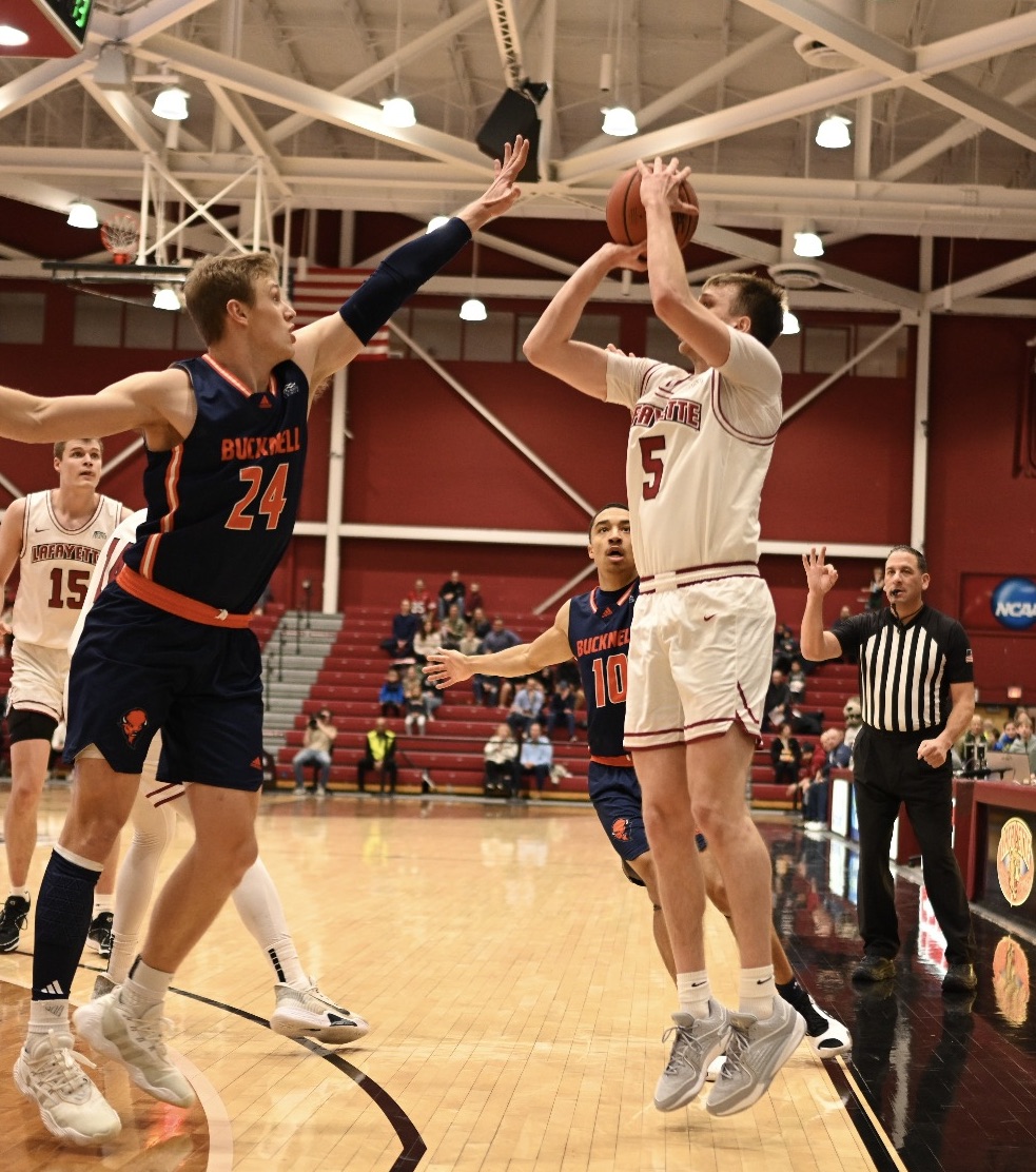 Senior guard Eric Sondberg shoots over a Bucknell defender earlier this year. (Photo by George Varkanis for GoLeopards)