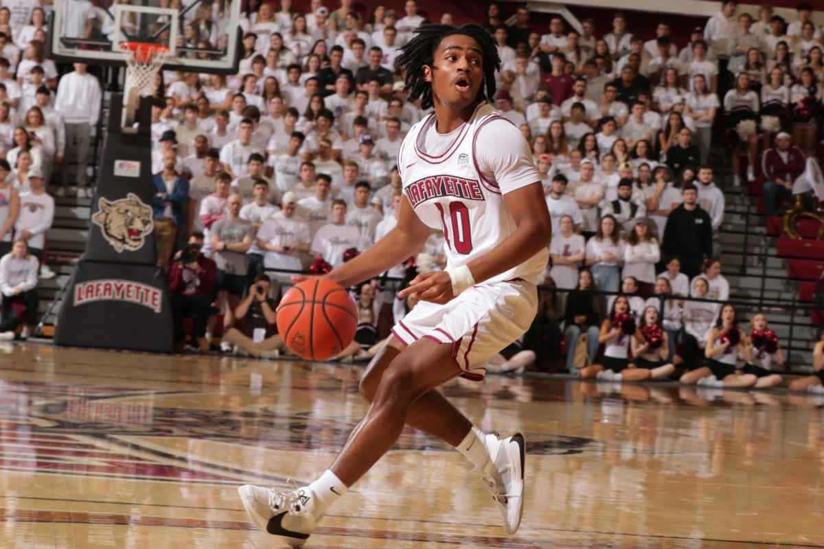Freshman guard Mark Butler dribbles down the court against Lehigh. (Photo by Rick Smith for GoLeopards)