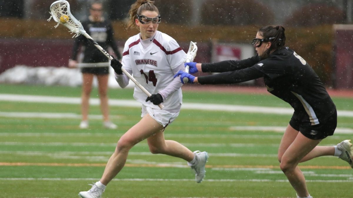 Senior midfielder Claire Culligan drives to the cage against Bryant. (Photo by Rick Smith for GoLeopards)