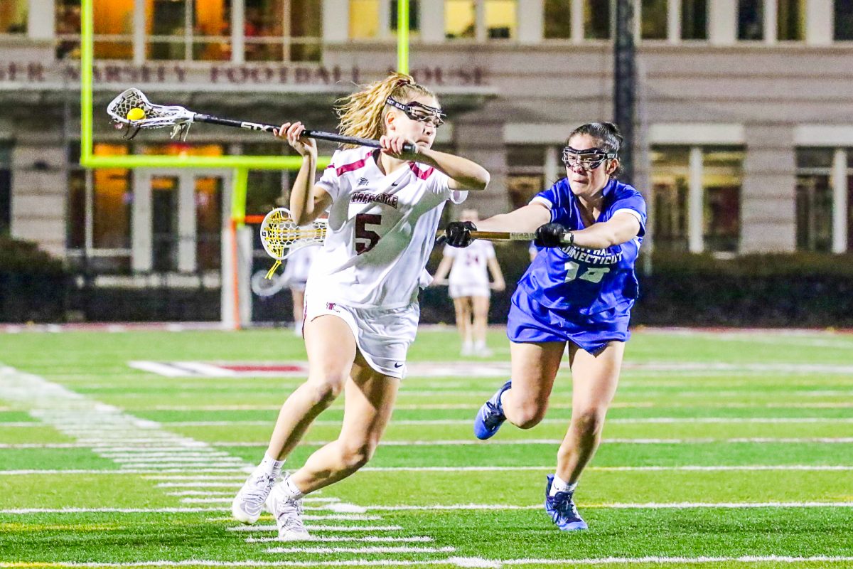 Senior midfielder Abby Romano drives to the cage during her hat trick performance against Central Connectict State University. (Photo by Rick Smith for GoLeopards)
