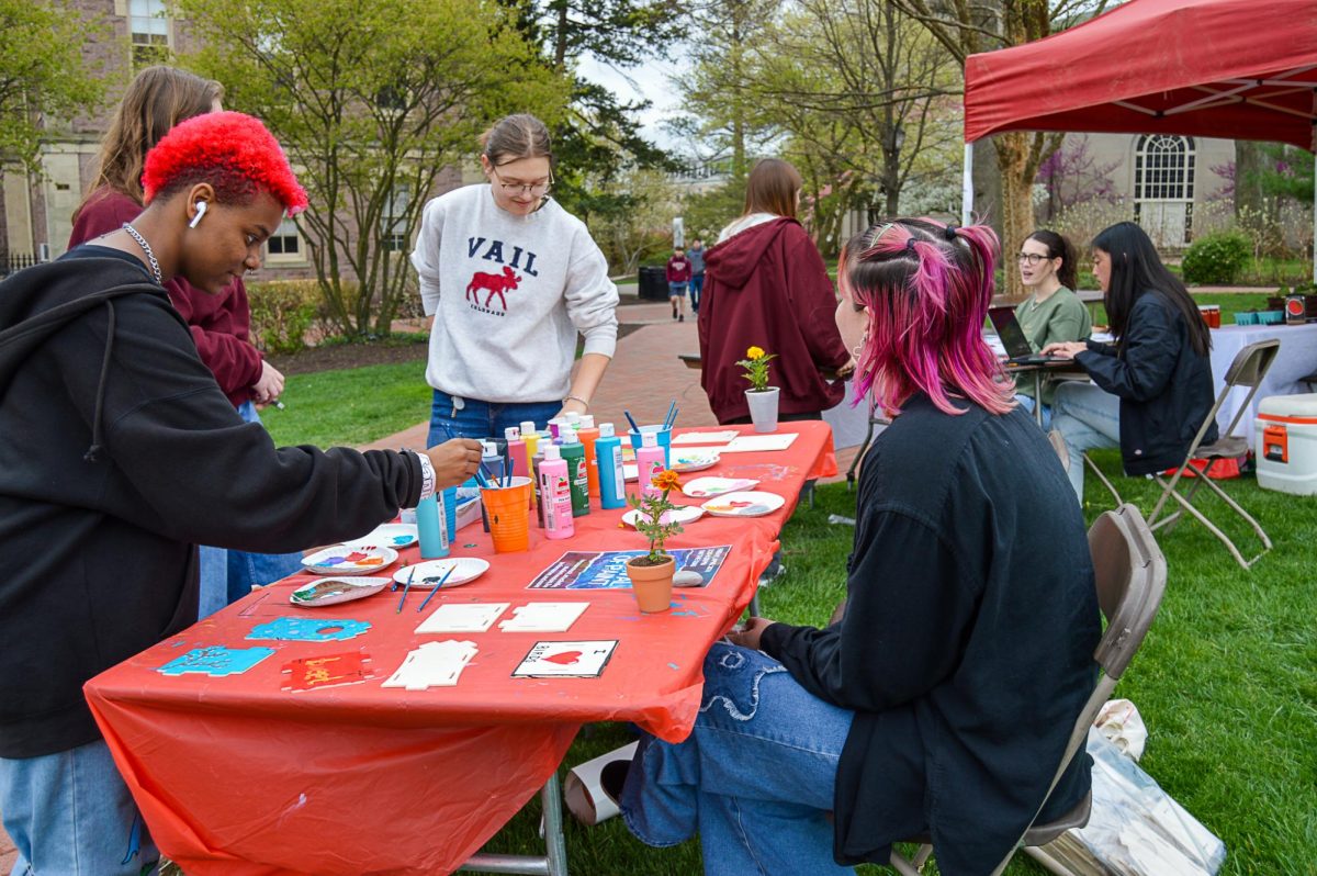 Students painted bird houses at one of many EarthFest tables.