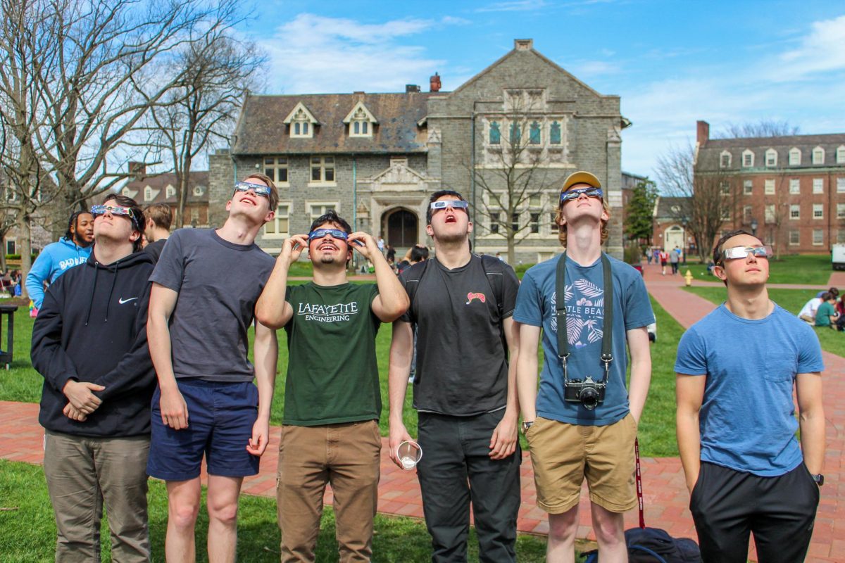 Students+gathered+on+the+Quad+to+watch+the+historic+eclipse.+