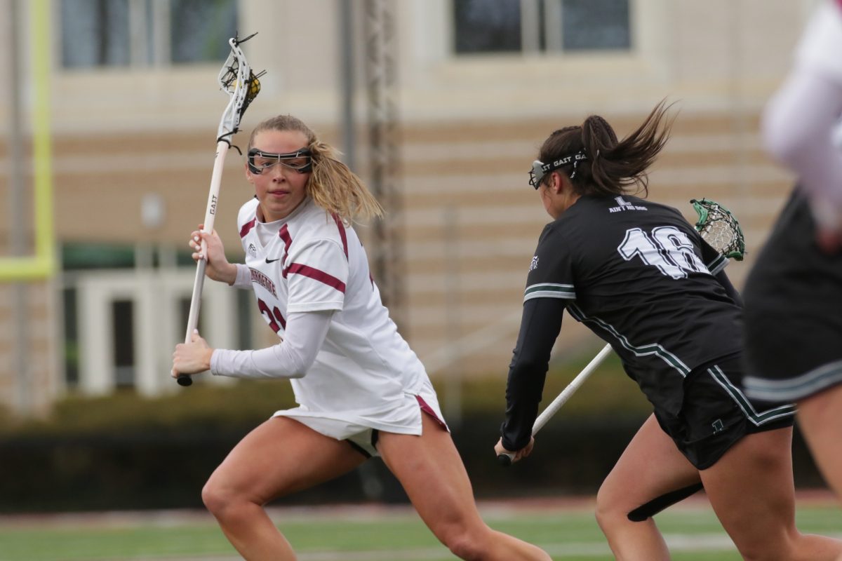 Junior+attacker+Sara+Rogers+evades+a+Loyola+Maryland+defender+on+April+6.+%28Photo+by+Rick+Smith+for+GoLeopards%29