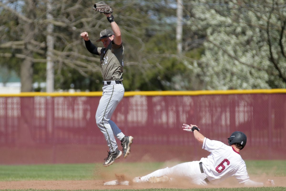 Freshman+utility+player+Luke+Caucci+slides+for+the+base.+%28Photo+by+Rick+Smith+for+GoLeopards%29