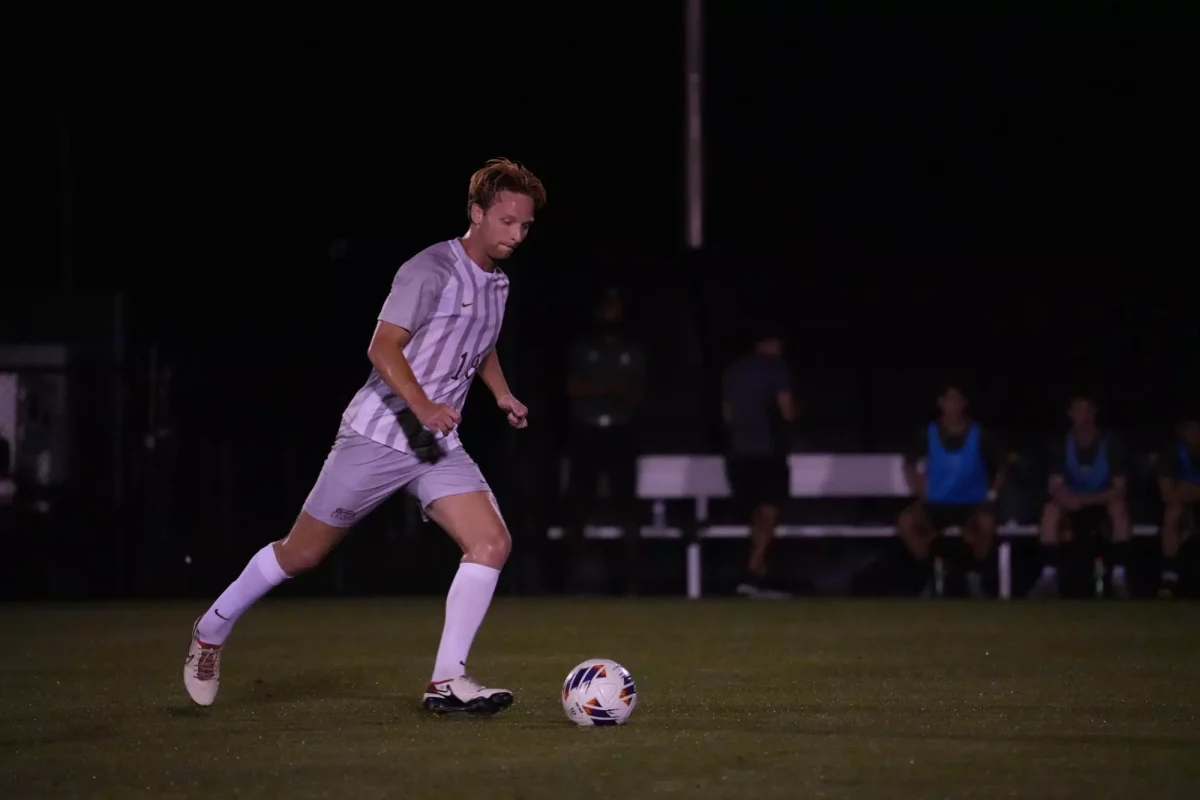 Senior midfielder Carter Houlihan dribbles in open space against Siena on Wednesday night. (Photo courtesy of GoLeopards)