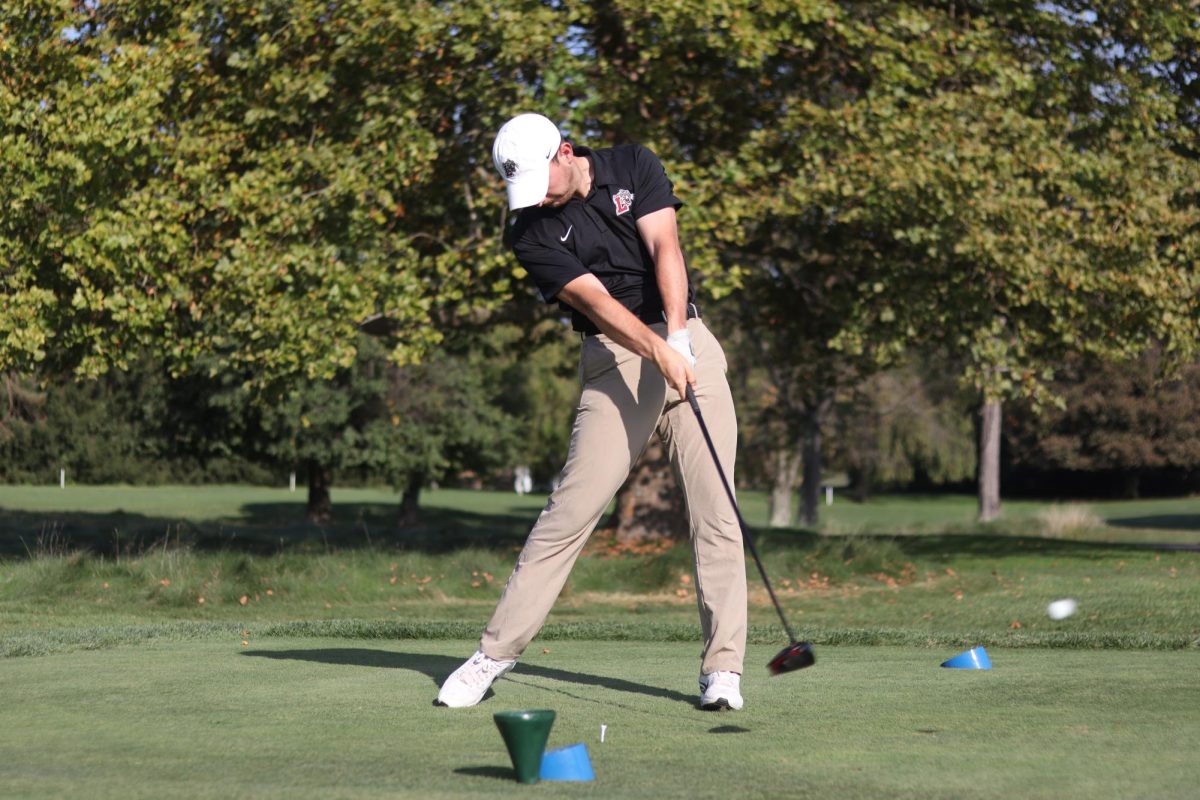 Senior Michael Bell readies his swing at the Naval Academy Golf Club. (Photo courtesy of Grace Sanborn '25)