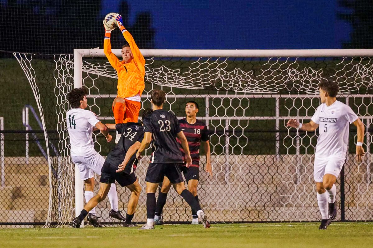 Senior goalkeeper Griffin Huff makes a save against Binghamton. (Photo by Rick Smith for GoLeopards)