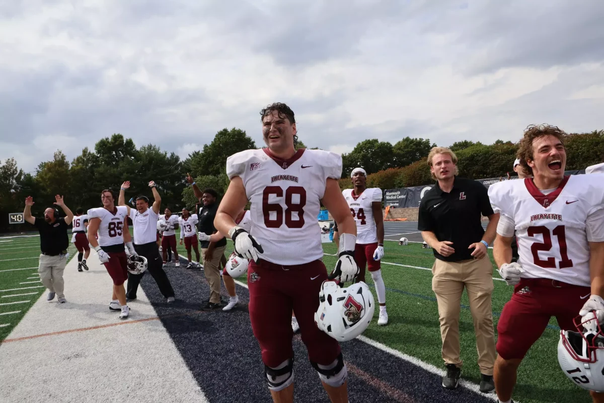 The football team celebrates a last-minute victory against Monmouth. (Photo by Rick Smith for GoLeopards)