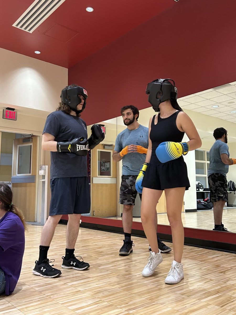 "Fight or Flight Night" began with club members demonstrating basic boxing skills. (Photo courtesy of Anica Kim '27)