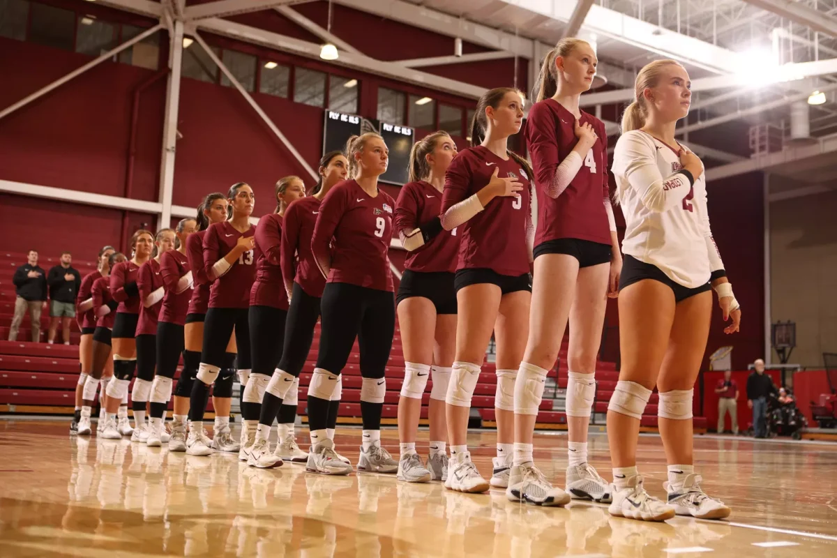 The volleyball team lines up before its game against Navy on Oct. 13. (Photo by Rick Smith for GoLeopards)