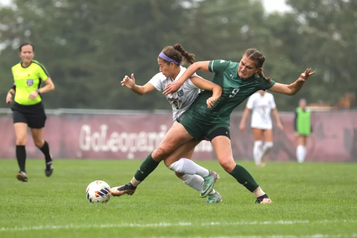 Senior midfielder Ani Khachadourian fights for the ball against a Loyola University Maryland player. (Photo by Rick Smith for GoLeopards)