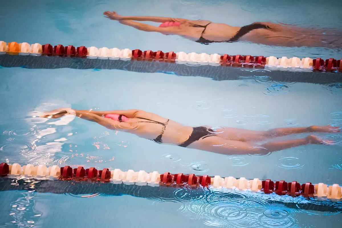 Two swimmers come off a turn in the swimming and diving team's season-opening meet against Loyola. (Photo by Jasmin Lara for GoLeopards)