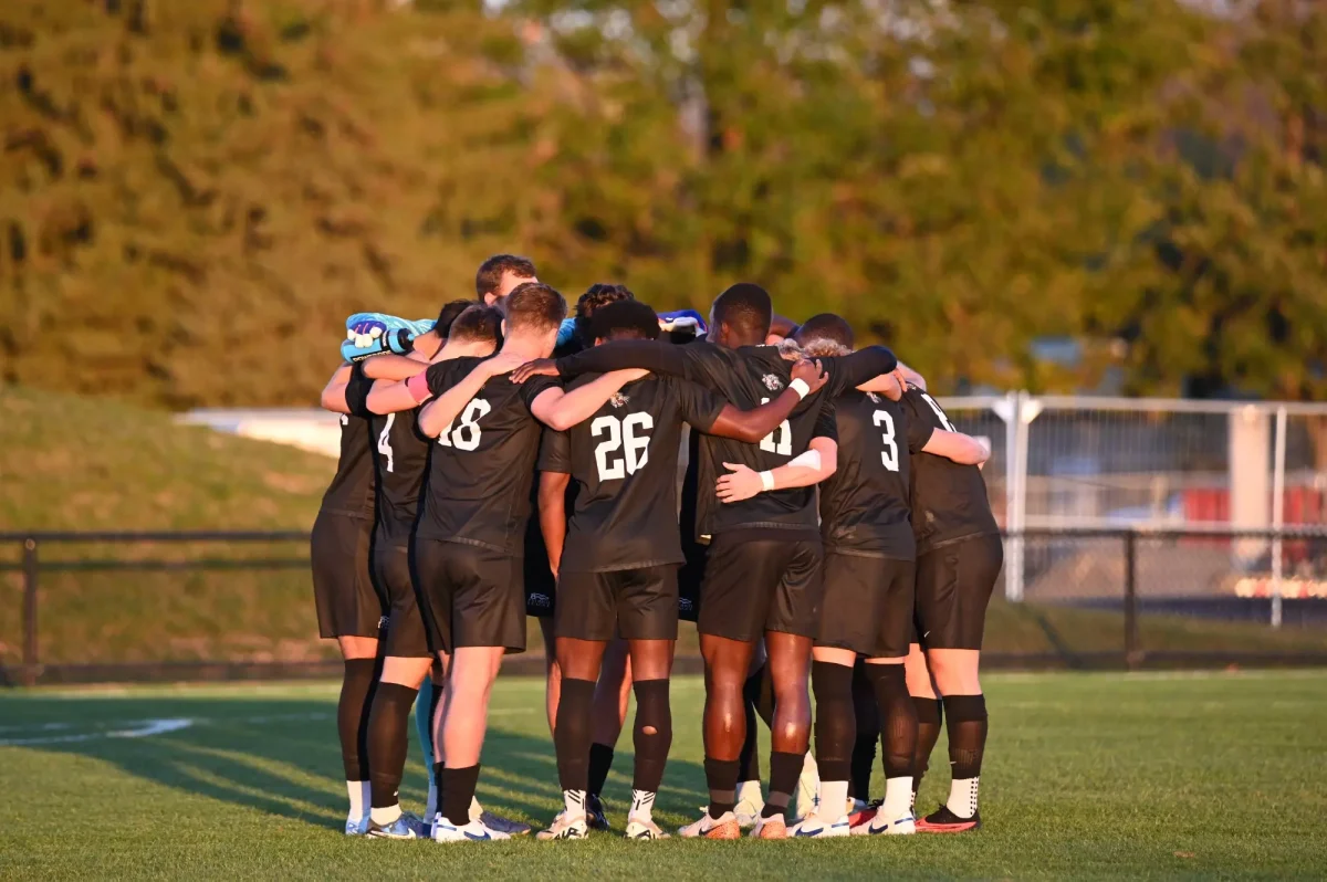 The men's soccer team huddles before the start of its game against Holy Cross on Oct. 12. (Photo by George Varkanis for GoLeopards)