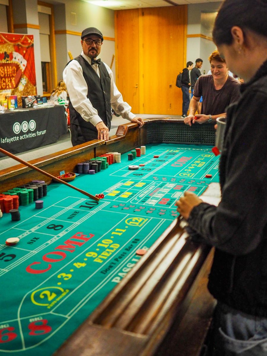 Students have fun at the craps table.