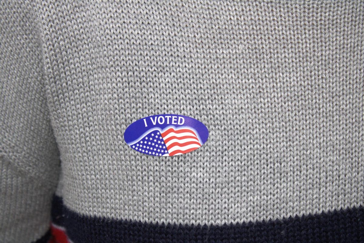 A Lafayette student shows off their 'I Voted' sticker.