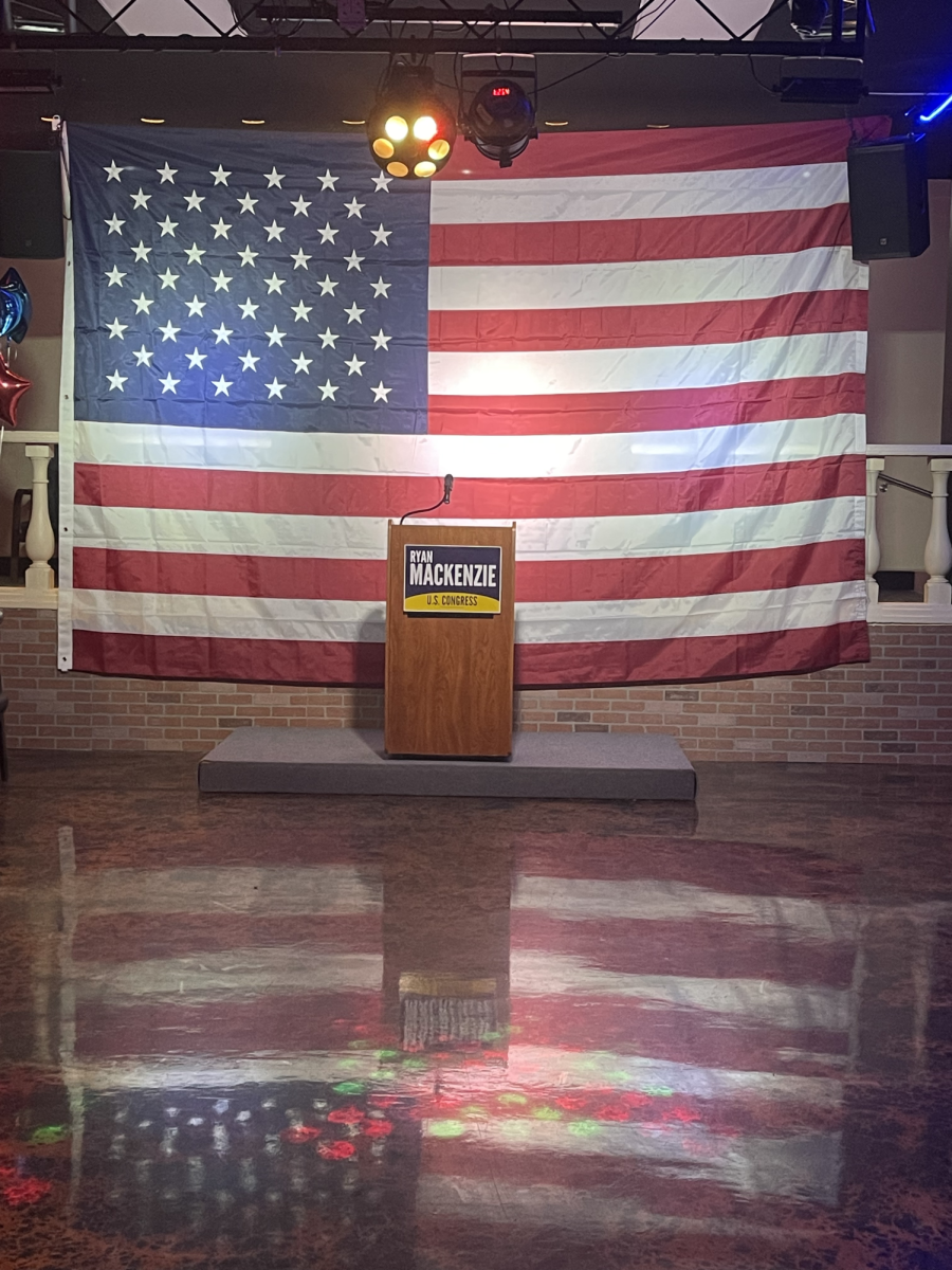 The podium at Mackenzie’s watch party sits front and center as attendees wait for speakers.