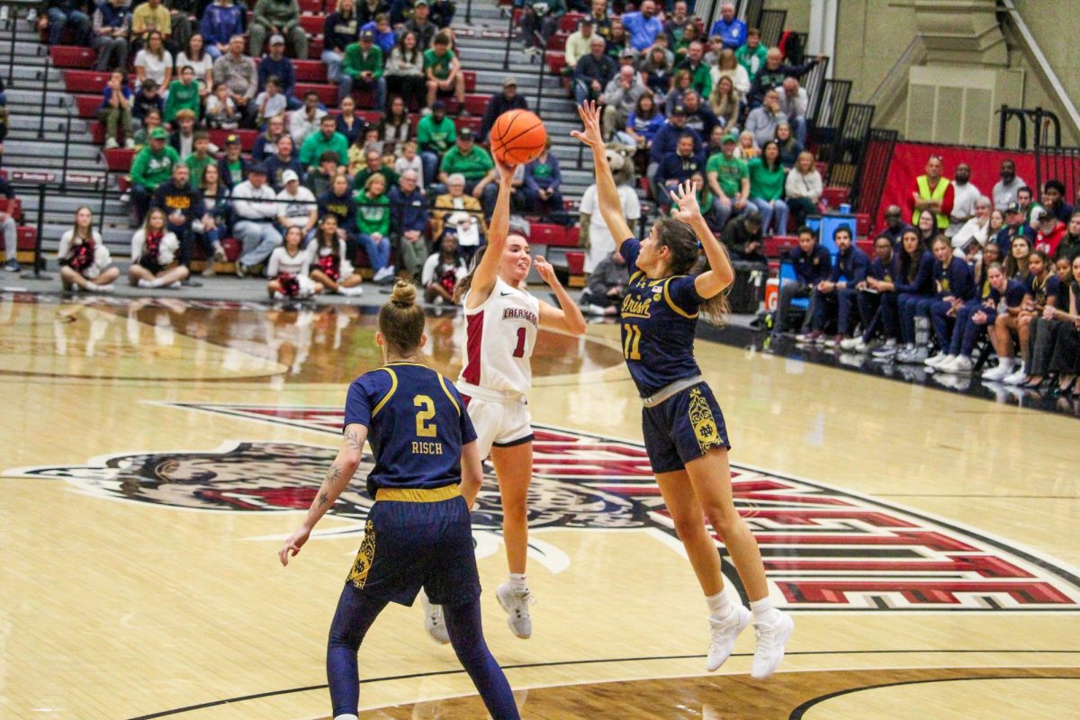 Senior guard Abby Antognoli tries to sneak a shot over a Notre Dame defender in Sunday's game. 