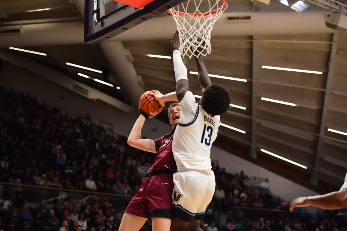 Senior center Justin Vander Baan looks to finish through contact against Villanova. (Photo by Hannah Ally for GoLeopards)