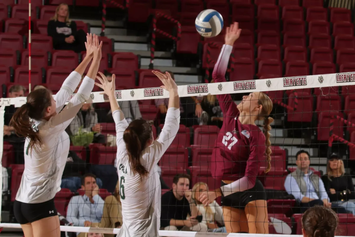 Senior outside hitter Nina Kernan leaps for a spike in a Nov. 2 matchup against Loyola University Maryland. (Photo by Rick Smith for GoLeopards)