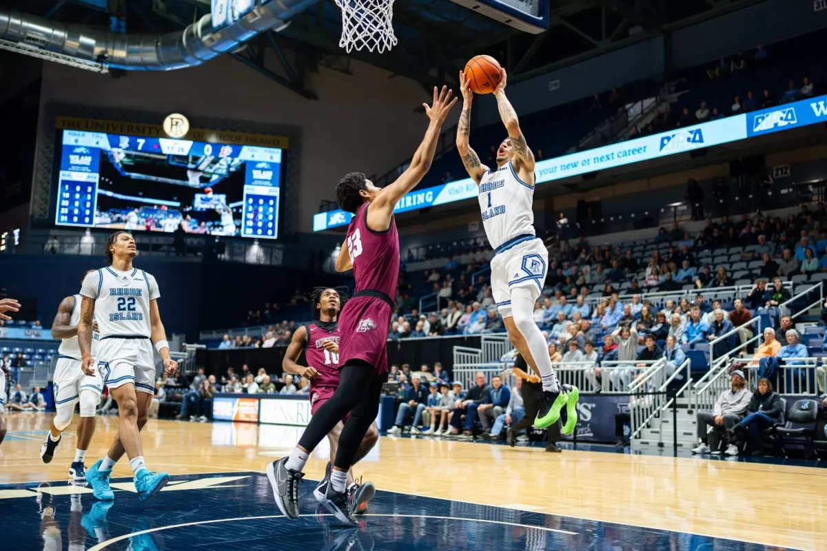 Sophomore forward Joshua Wyche contests a shot against Rhode Island on Wednesday night. (Photo courtesy of GoLeopards)