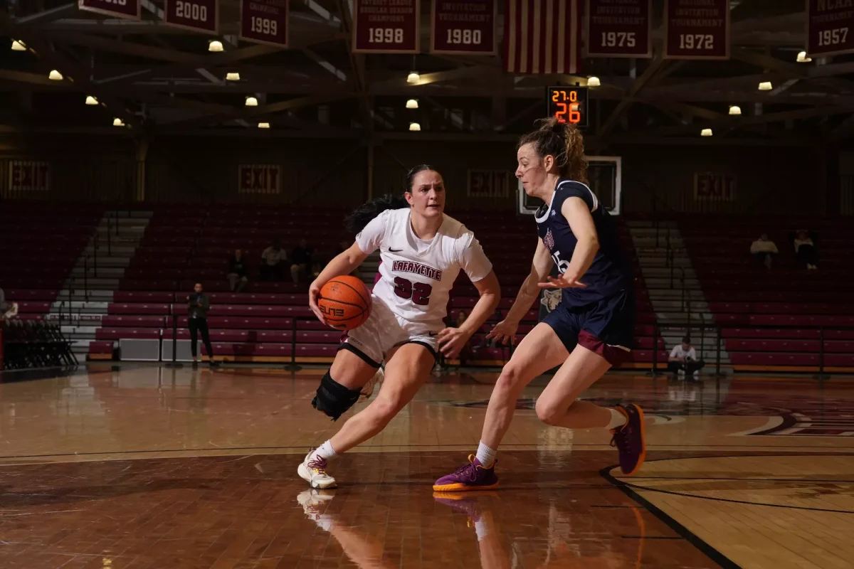 Senior guard Halee Smith attempts to dribble past a FDU defender in Wednesday night's game. (Photo by Jasmin Lara for GoLeopards)