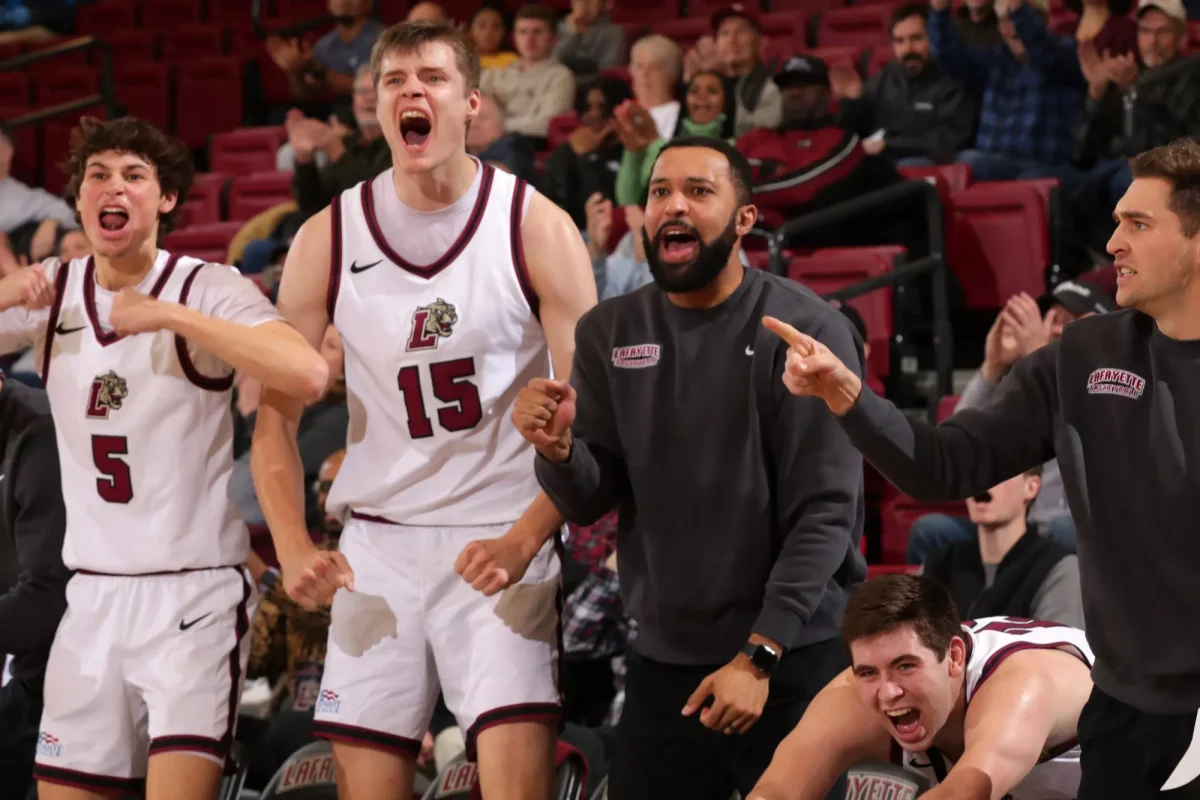 The men's basketball team celebrates during an 82-65 home win over Holy Cross on Jan. 11. (Photo by Rick Smith for GoLeopards)