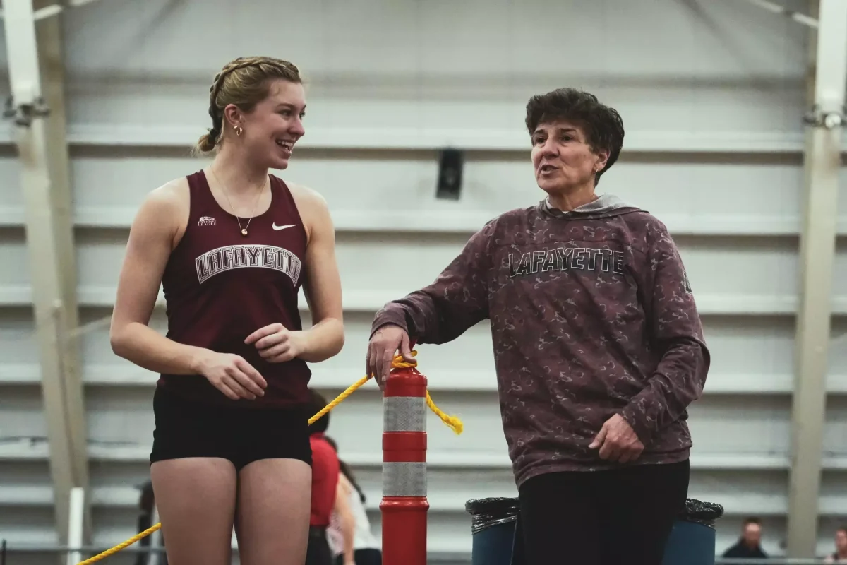 Senior Julia Greeley talks with head coach Michele Curcio at the Moravian Invite on Jan. 18. (Photo by Jasmin Lara for GoLeopards)