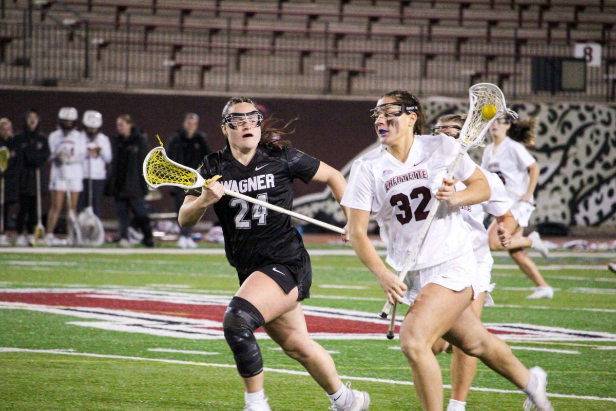 Junior midfielder Katie Marrs drives up the field in the Leopards' 13-9 comeback victory over Wagner College.