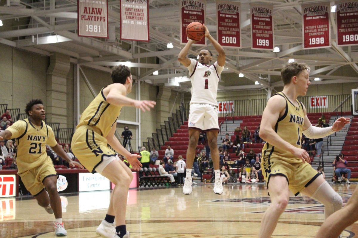 Freshman guard Caleb Williams pulls up for the jumper against Navy. (Photo by Austin Carey '27)