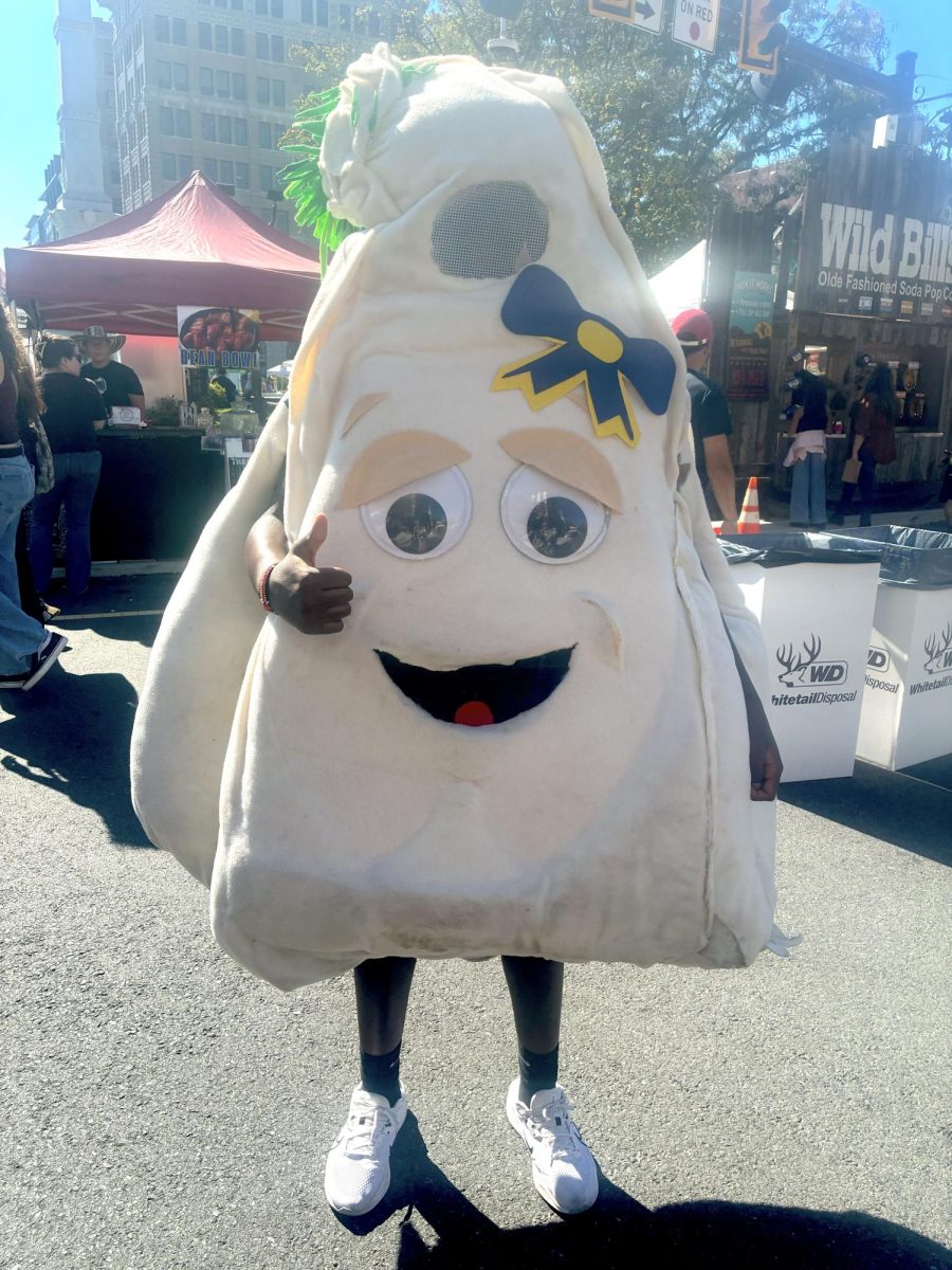 A Garlic Fest volunteer wearing the "stinky garlic" suit.