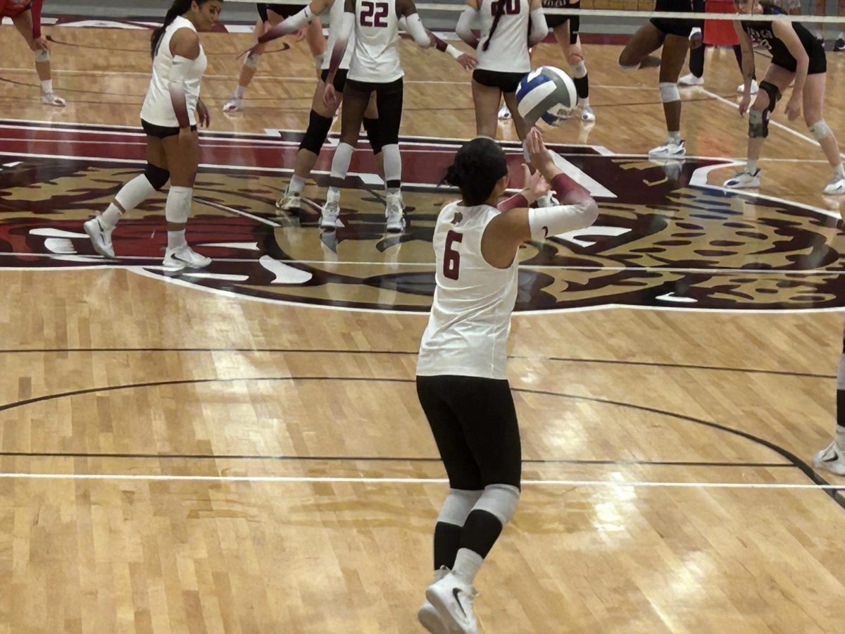 Sophomore libero Ella Xiong serves against American University in last Friday’s match.